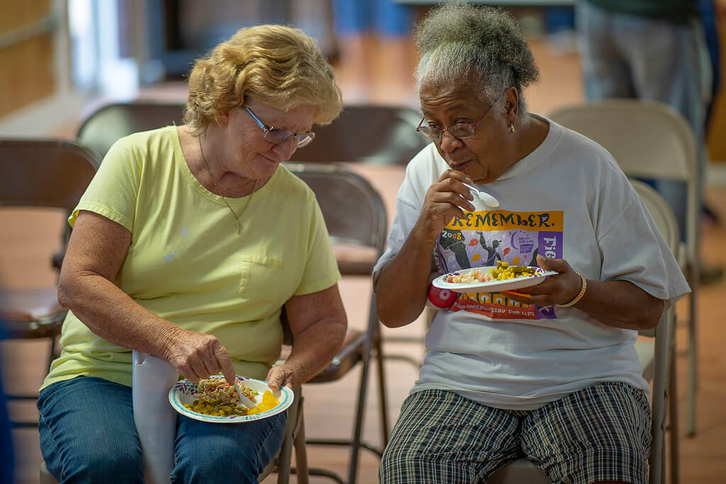 Seniors eating food